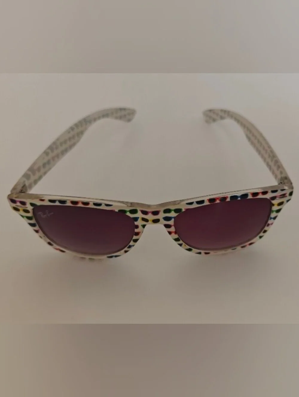 Ray-Ban Wayfarer Special Series #4 white frame covered in colorful sunglasses